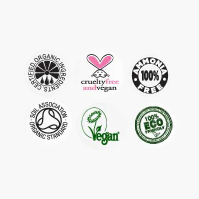 The image displays a collection of circular stickers featuring various logos, including one for organic ingredients, another for vegan products, and others representing different certifications or affiliations.